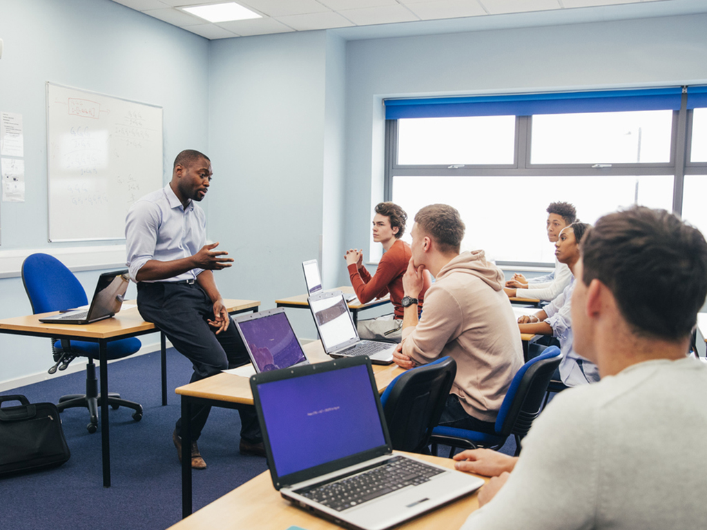 Tutor and students in a classroom