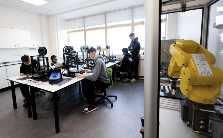 Students working in the advanced manufacturing facility